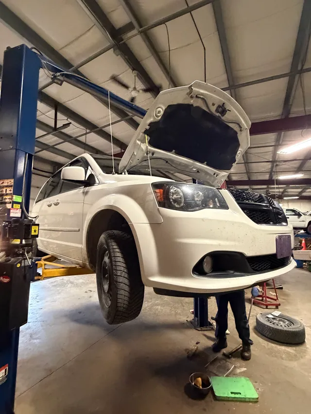 Minivan on a workshop lift