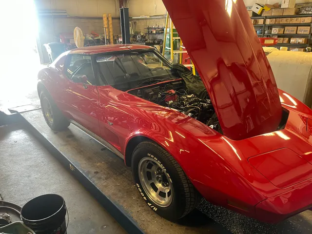 Red classic car in the workshop
