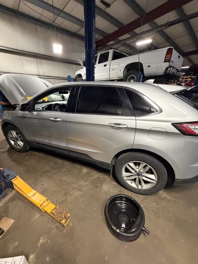 Silver SUV inside the workshop